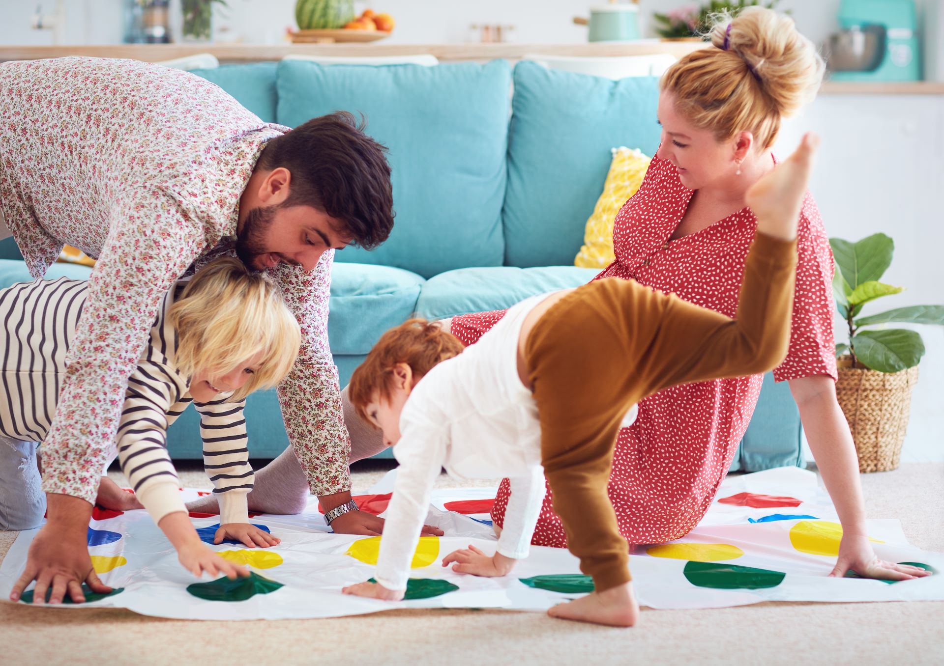 a family with young children playing twister