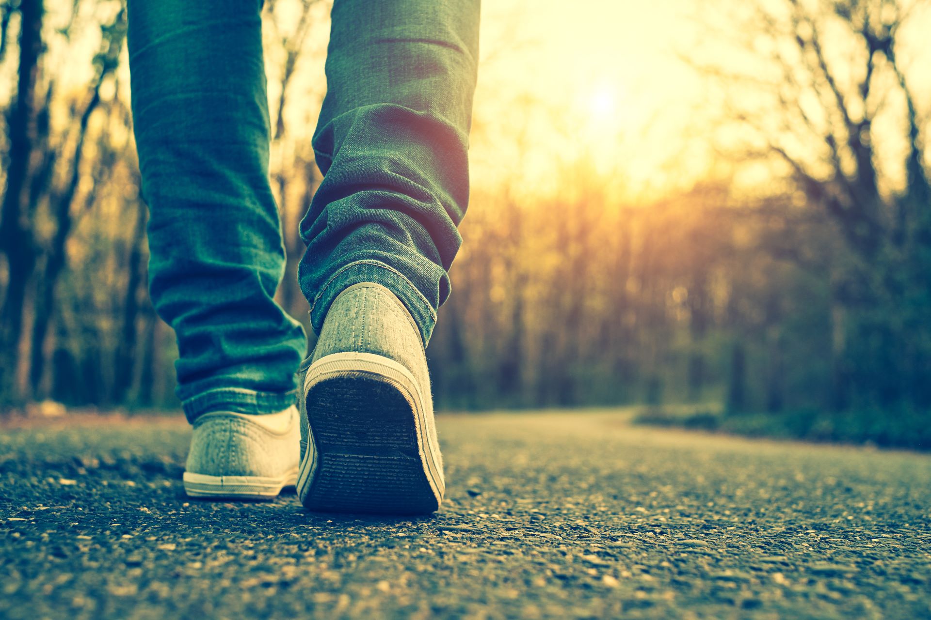 a close up of someone walking on a path