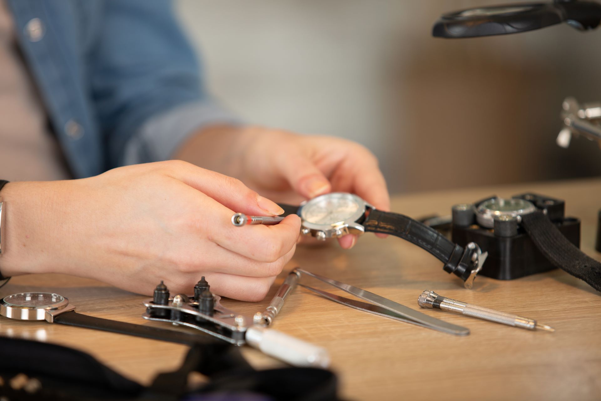 a man repairing a watch