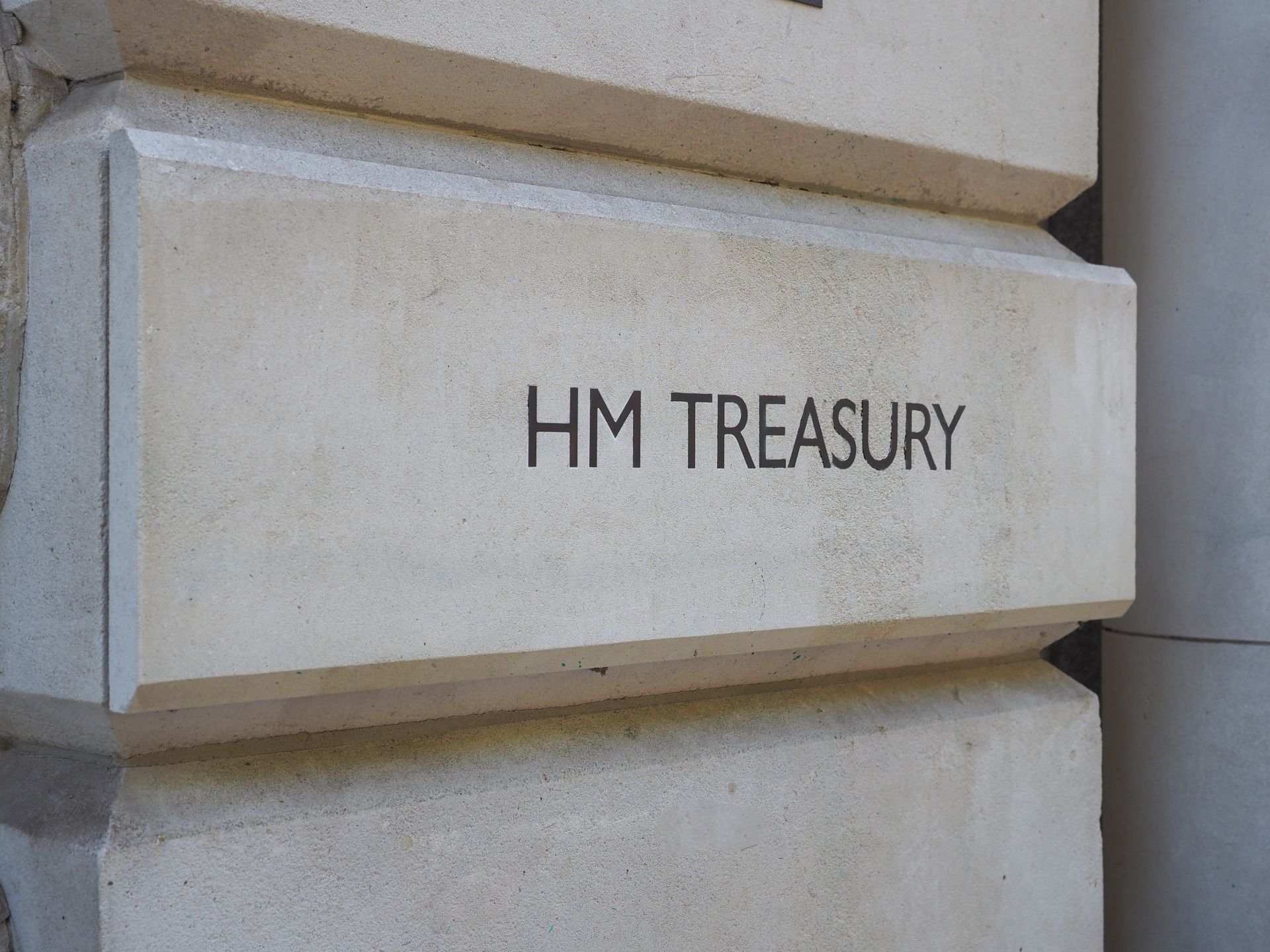 a close up of hm treasury sign